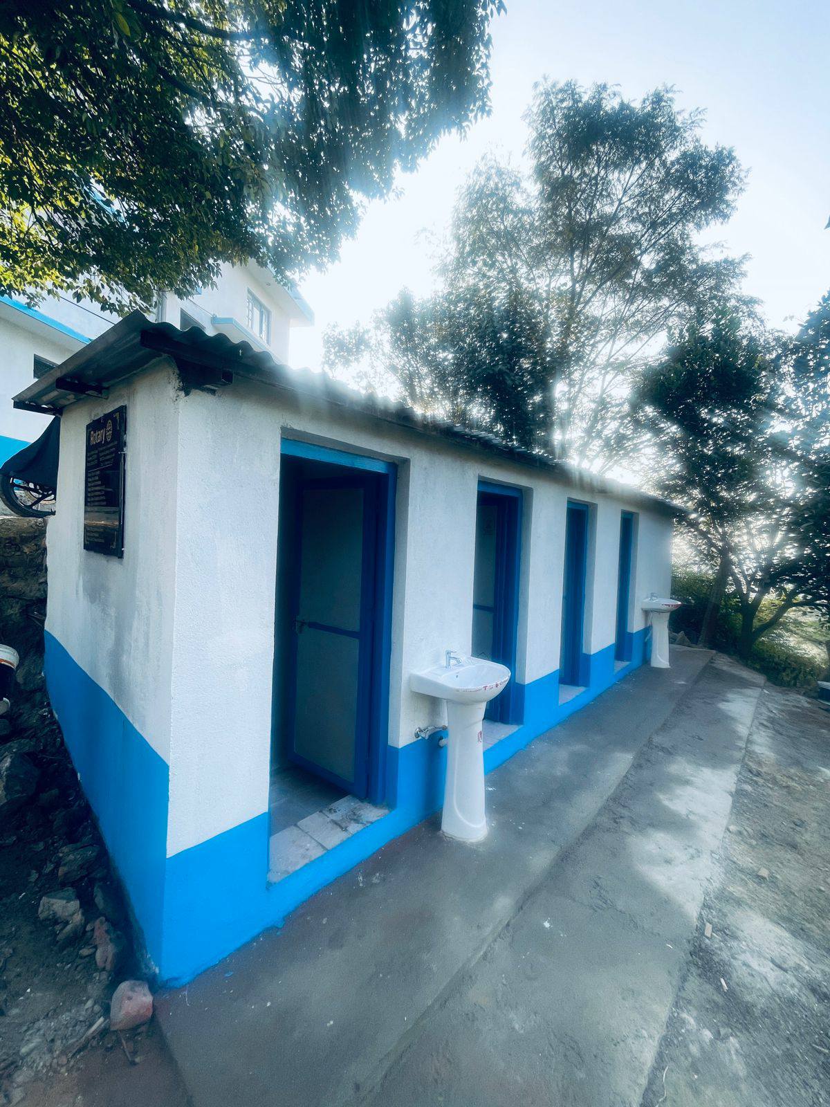 Construction of a toilet building at Dharmasthali Police Post and assistance with computers and printers.